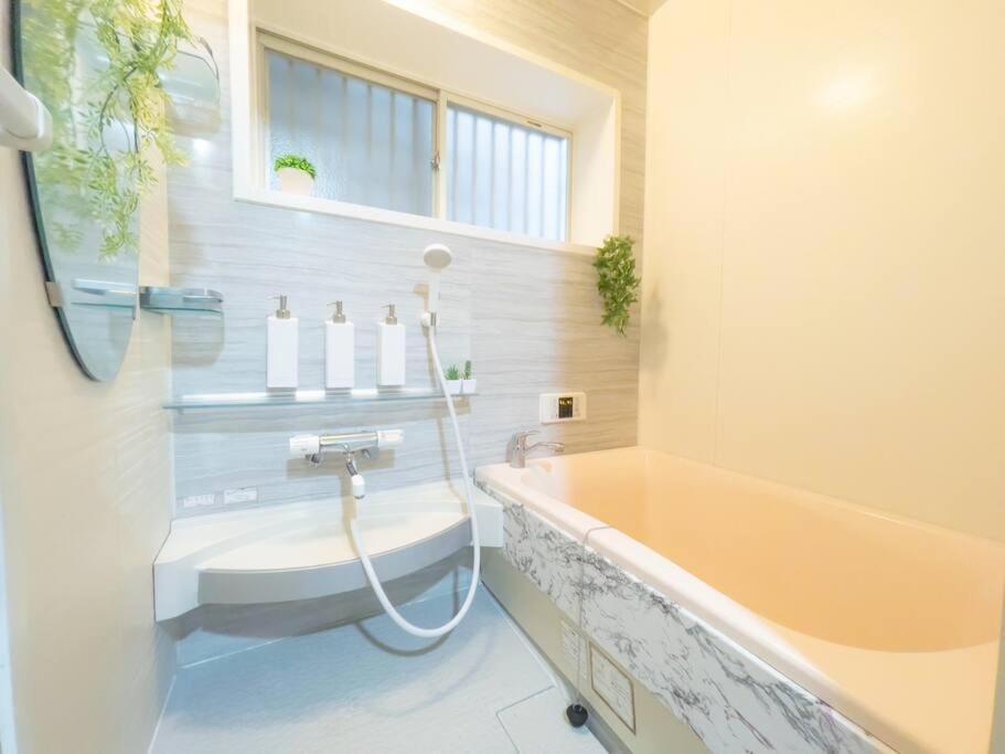 団,最大16名,レンタルサイクル無料,usjまで好アクセスの3階建て Apartamento *